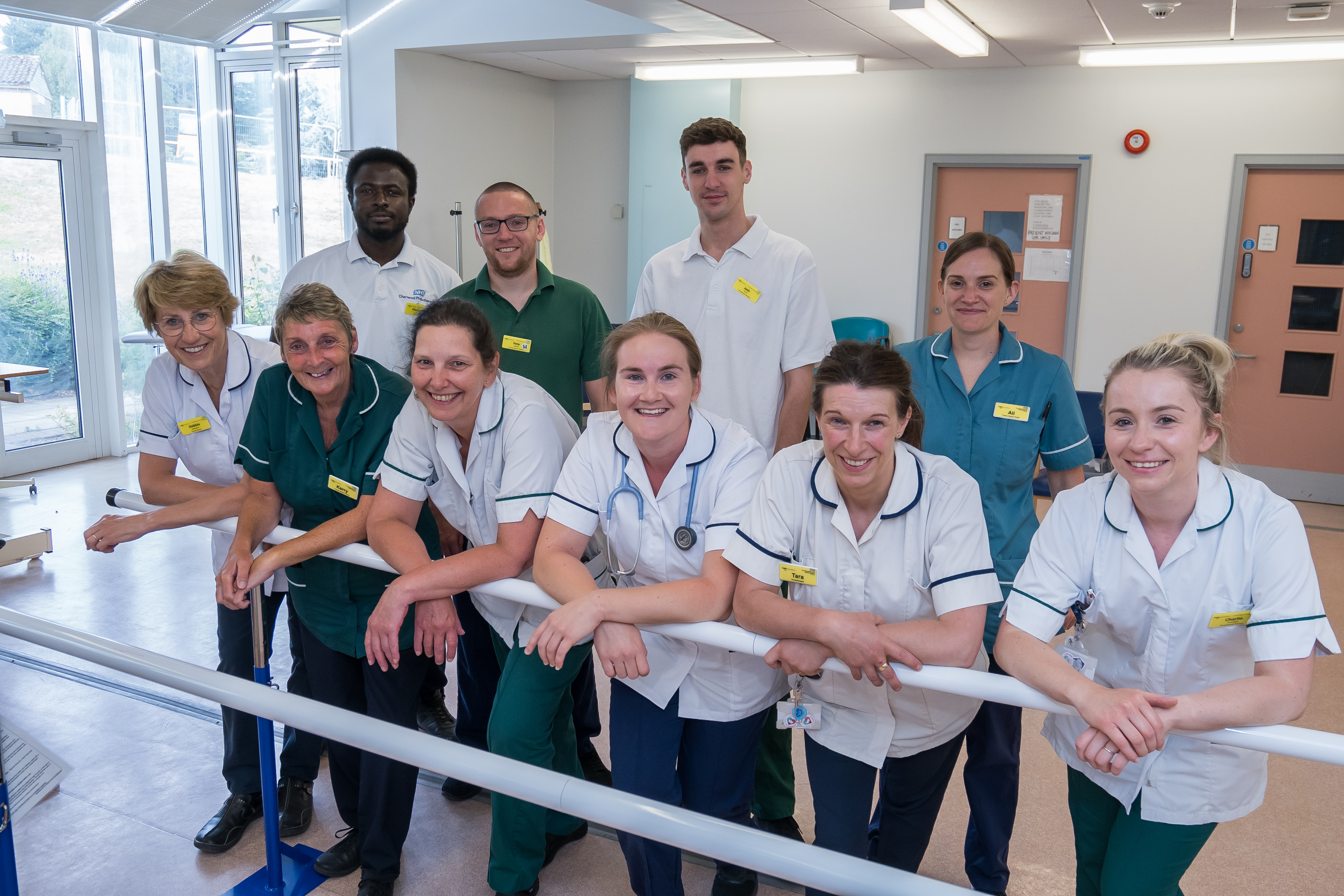 group of staff wearing hospital uniforms