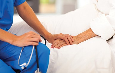 Nurse comforts patient, Shrewsbury Hospital, Shropshire